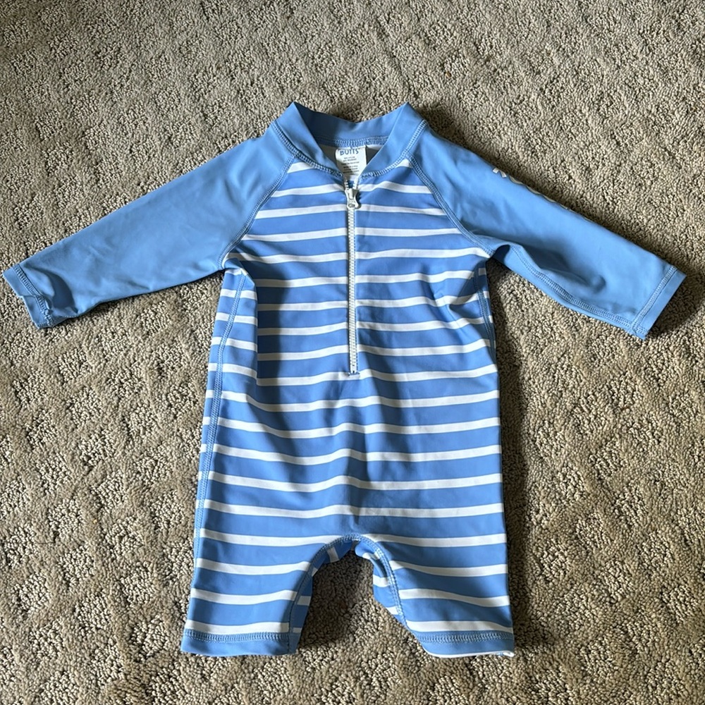 Like new Rugged Butts one piece rash guard blue and white stripe.